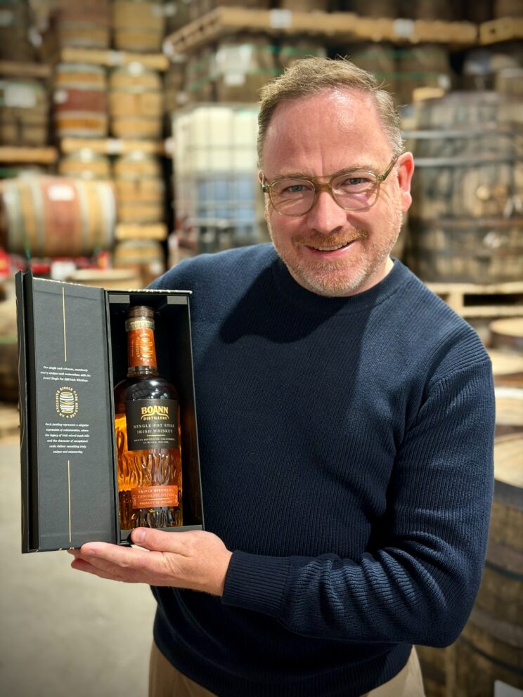 Barry Chandler with the Boann Chocolate Bitters whiskey in its presentation box